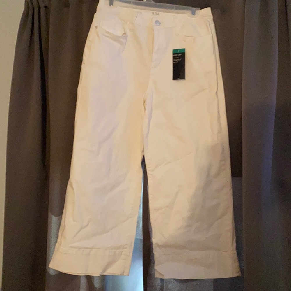 Brand new.  Never worn. White wide leg capris.
